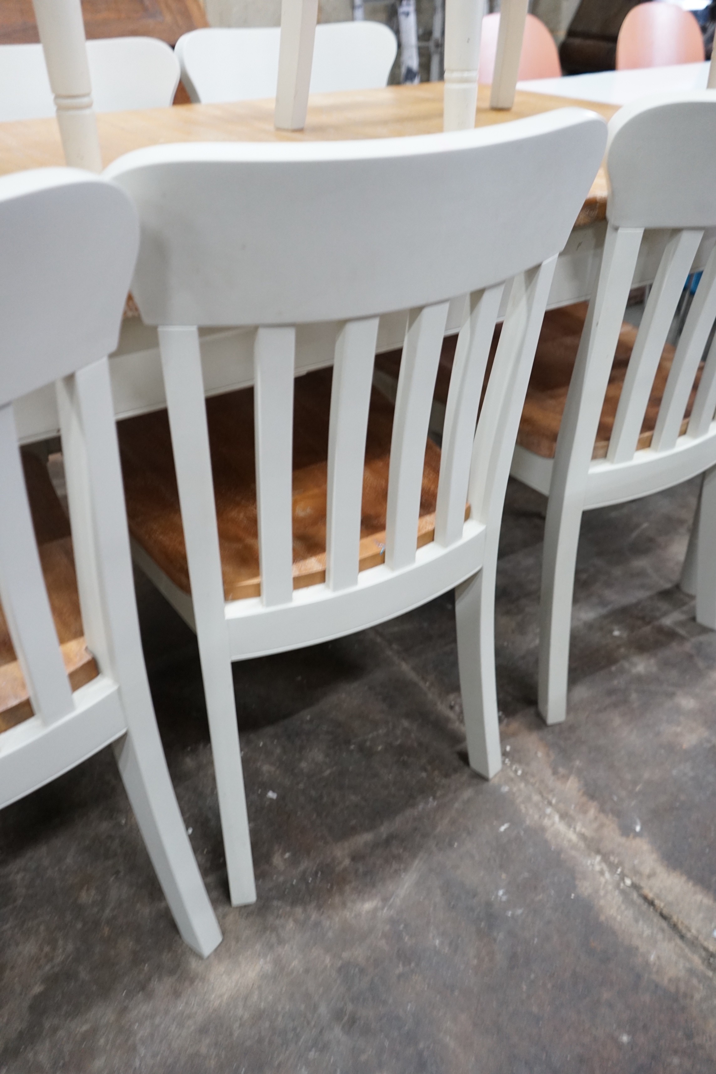 A modern John Lewis part painted extending dining table and eight matching chairs, table width 209cms extended, depth 90cm, height 78cms.